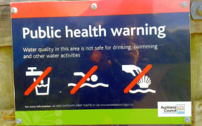 A warning sign near Meola Creek in Auckland.