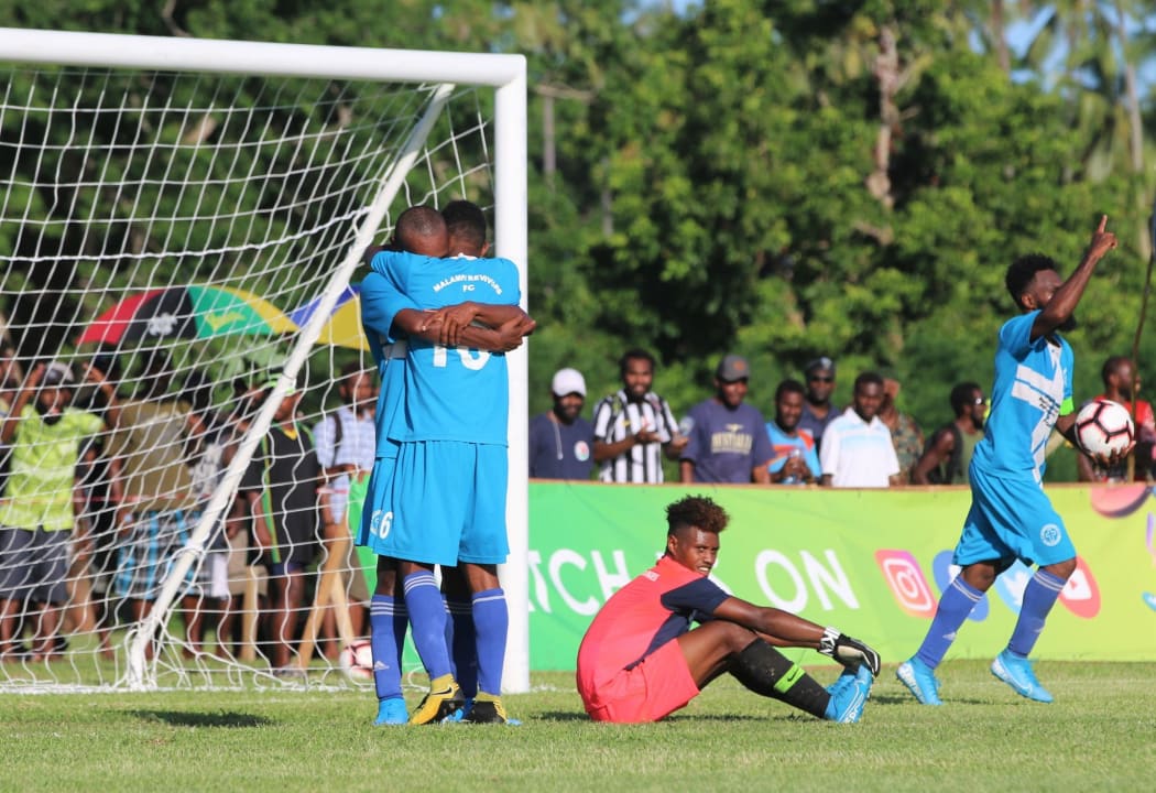 Malampa Revivors celebrate Armando Ravo's late equalising goal.