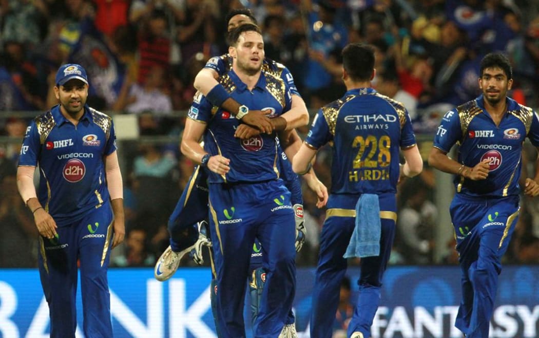 Mitchell McClenaghan and the Mumbai Indians celebrate another wicket but it wasn't enough to steer them to victory.