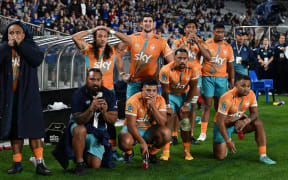 Moana Pasifika players react in the final moments of the game as the referee awards a penalty try to the Blues.