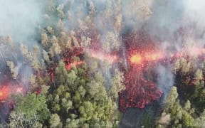 Still from drone footage of lava flow in Leilani Estates, Hawaii