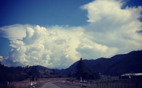 A front moves over Nelson, pushing tropical heat ahead of it.