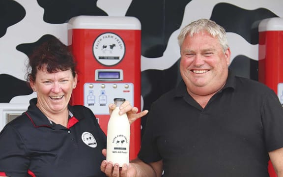 Otaki dairy farmers Stacy and Andrew Faith with their raw milk vending machine