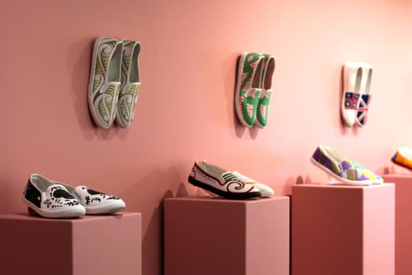 The marshmallow pink walls are used in the exhibition Worn to buck the stereotype of those in prison.