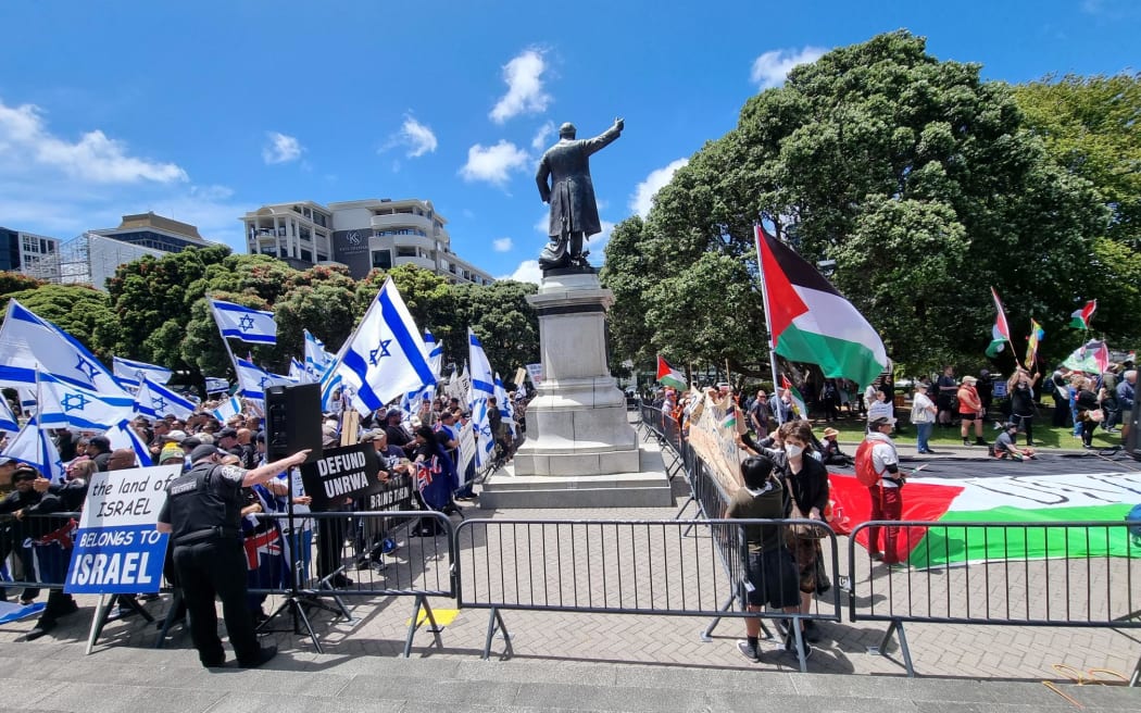 Two large marches, one pro-Palestianian and the other pro-Israeli, are at Parliament with about 500 supporters on each side.
