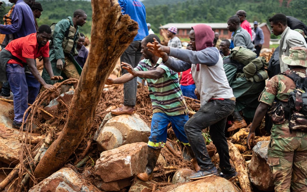 People search for survivors in Ngangu township Chimanimani, Manicaland Province, eastern Zimbabwe after the area was hit by the cyclone Idai.