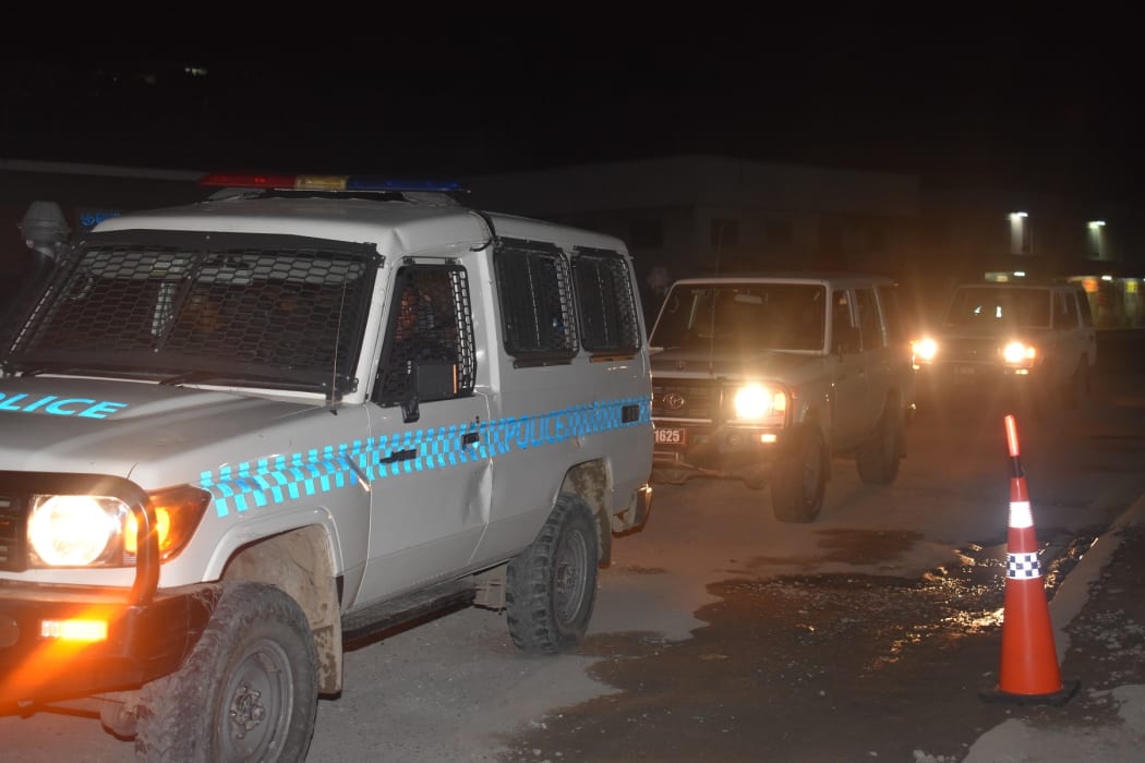 Solomon Islands' Police Response Team (PRT) on patrol during the first night of the country's trial lockdown. 29 August 2021