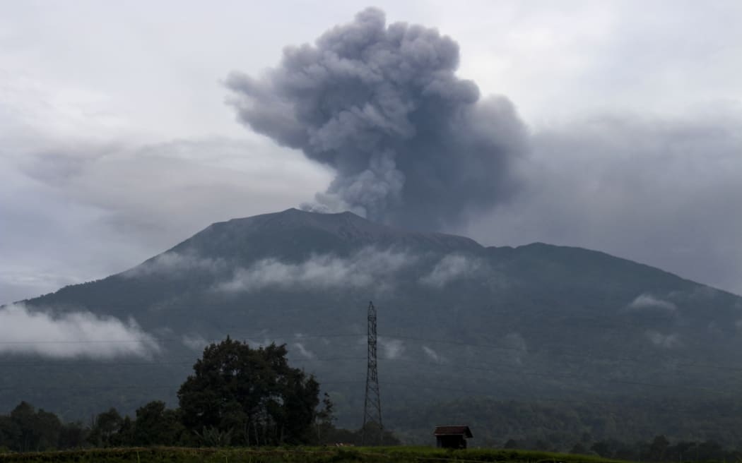 Ash continued to rise from Mount Marapi on 4 December, as seen from Batu Palano village, a day after the volcano erupted.