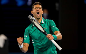 Novak Djokovic of Serbia celebrates after winning a game during round 3 of the 2021 Australian Open on February 12 2020, at Melbourne Park in Melbourne, Australia.