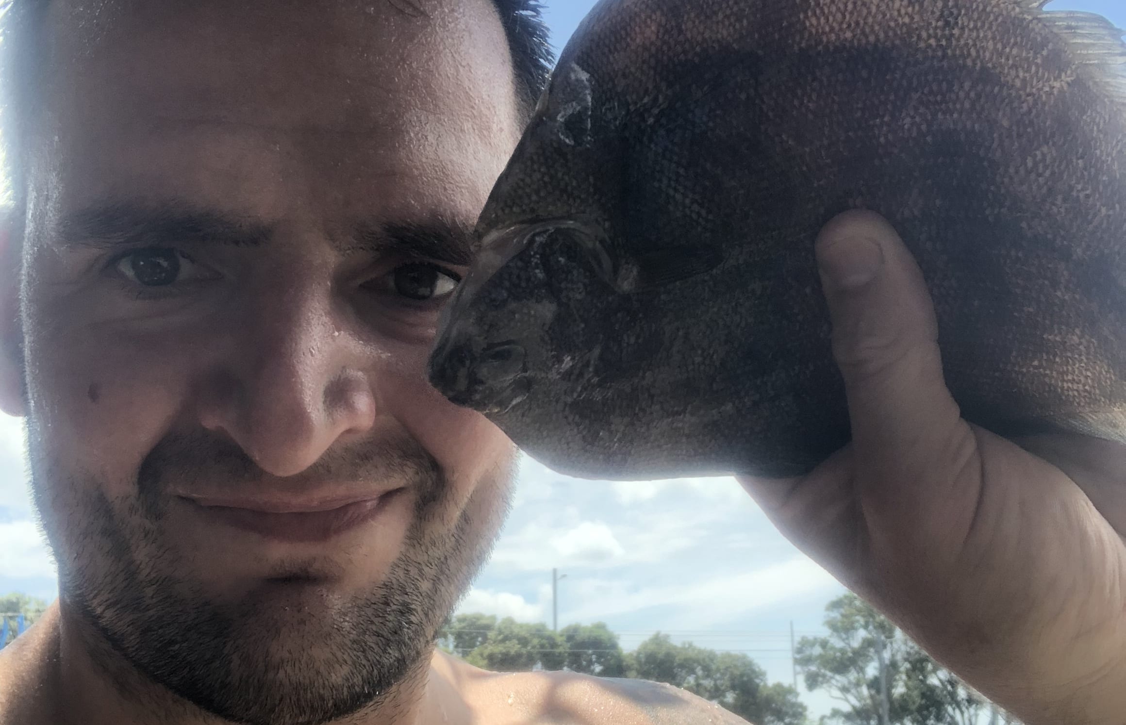 Russell Hogg with the flounder that fell on his head.