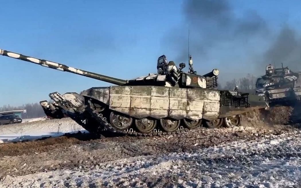Image grab from footage released on Tuesday Feb 15, 2022 by Moscow shows tanks from the units of the Western Military District are returning to their points of permanent deployment (bases) from undisclosed location near Ukraine.