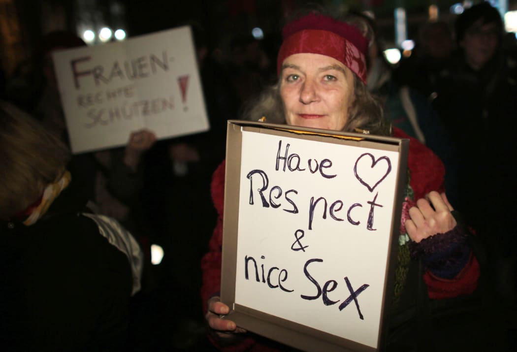 A woman in Cologne protests against sexism, following a mass sexual assault in the city on New Year's Eve.
