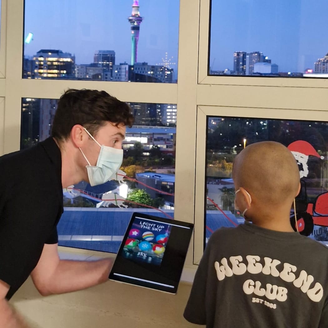 Starship patients use iPad to light up Sky Tower.