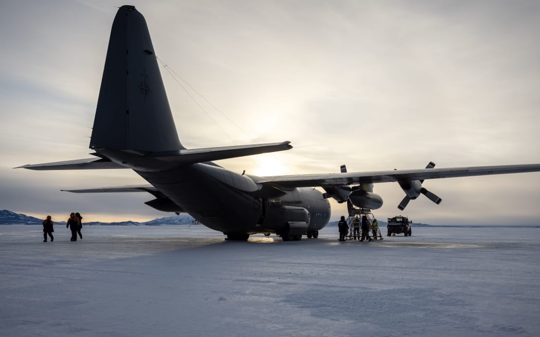 28 October, 2022 
The RNZAF C130 Hercules meant to fly Prime Minister Jacinda Ardern back to New Zealand from Antarctica on Friday night sits on the runway with crew and maintainence staff inspecting its broken down engine.
Photograph by Mike Scott