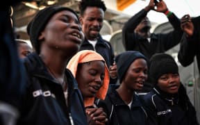 Christian migrants pray aboard the rescue ship MV Aquarius near the coast of Malta last year, heading to the Italian port of Messina.