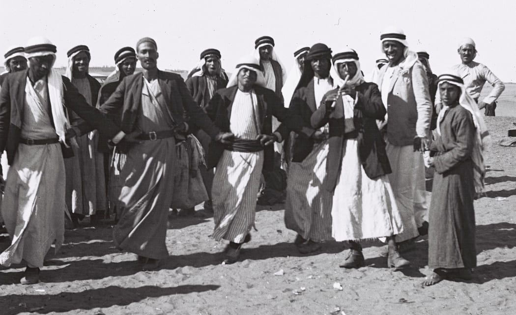 Farmers dancing the traditional dabke at a wedding reception of a Bedouin couple in the Negev, 1933.