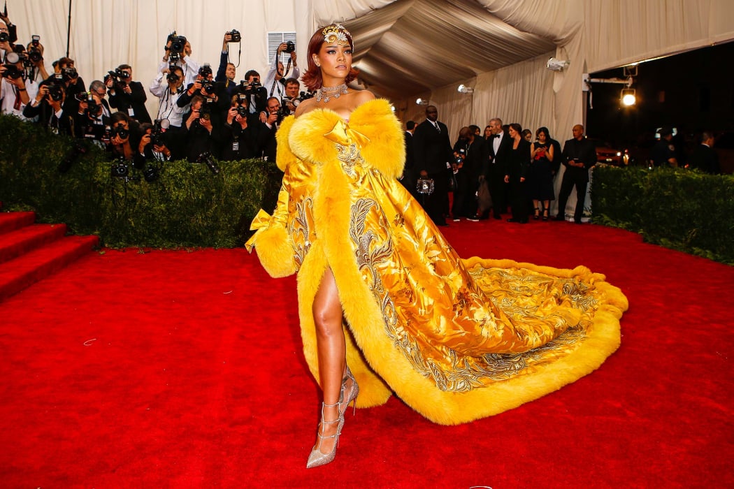 Rihanna (wearing Guo Pei) arrives at the red carpet for the 2015 Met Ball in The First Monday in May.