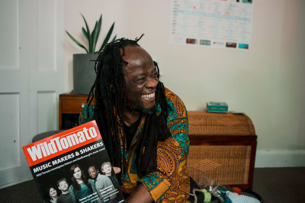 Judah shows a magazine he is on the cover of