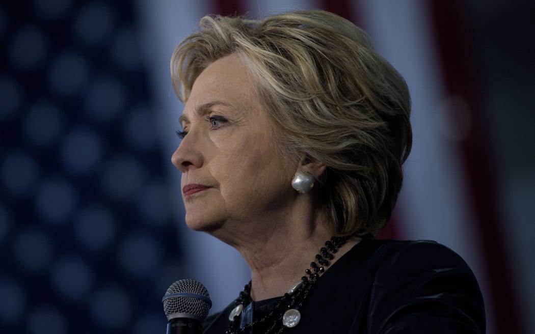 Democratic presidential nominee Hillary Clinton pauses while speaking during a Colorado Democratic party rally in the Palace of Agriculture at the state fairgrounds October 12, 2016 in Pueblo, Colorado.