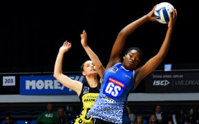 Mystics Grace Nweke (R) grabs the ball.