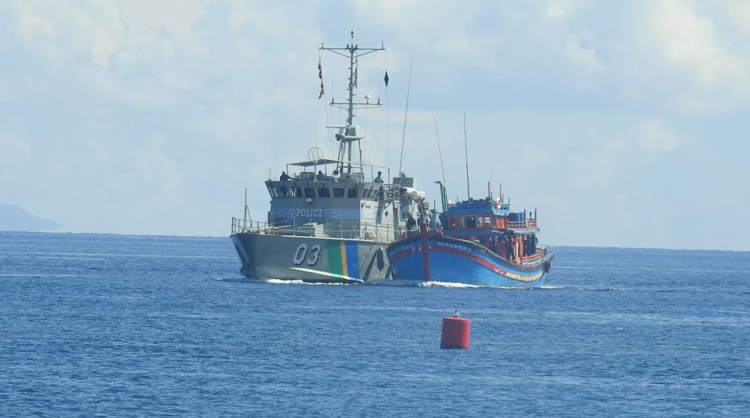 The Royal Solomon Islands Police patrol boat Lata escorts a Vietnamese Blue boat, caught fishing without a license in Rennell and Bellona Province, to the Aola Maritime Base in Honiara. 2017