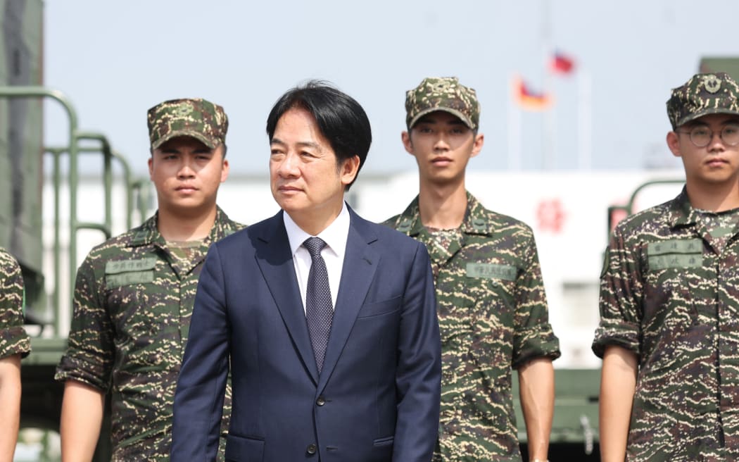 Taiwanese President Lai Ching-te arrives at a naval base in Taoyuan on October 18, 2024. (Photo by I-Hwa CHENG / AFP)