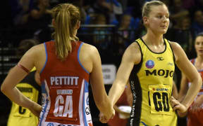 Pulse captain Katrina Grant shakes the hand of Swifts' Susan Pettitt