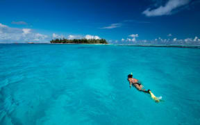 A snorkeler enjoys the waters of the CNMI.