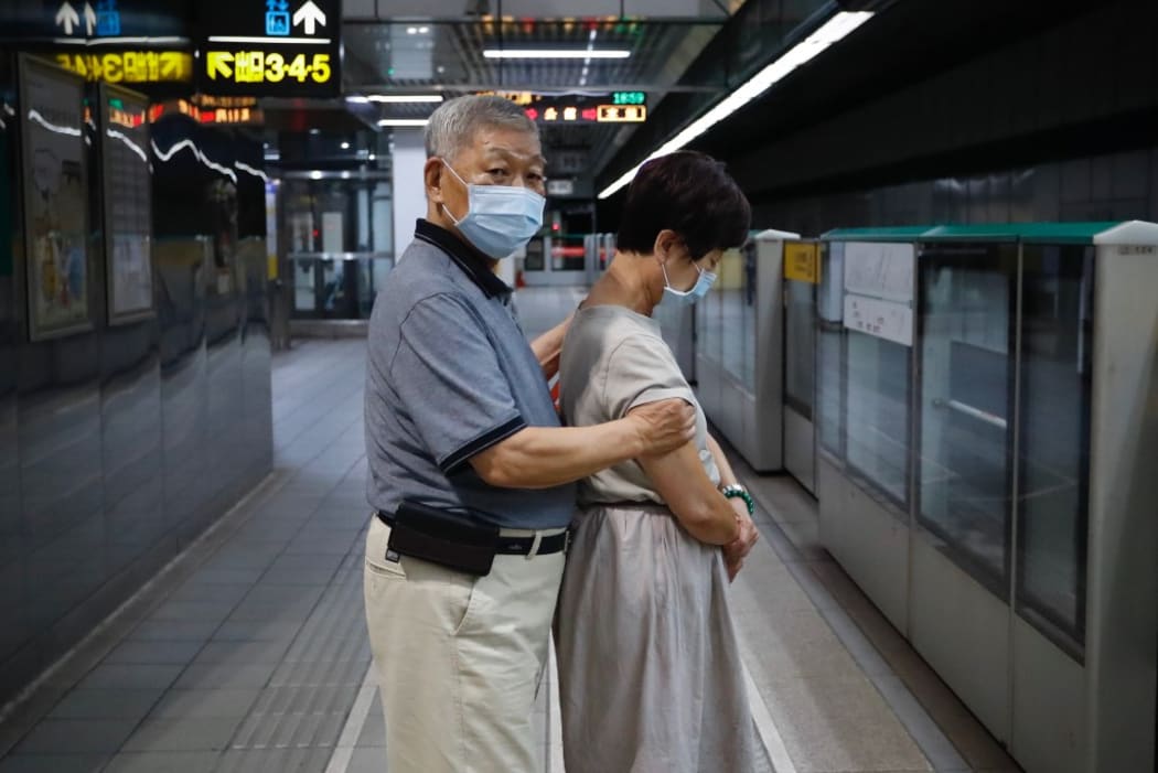 The daily routine of citizens who travel using the underground service MRT during peak hours in the evening in the capital, under the Covid-19 pandemic, Taipei City, Taiwan, 27 July 2020. (Photo by Ceng Shou Yi/NurPhoto)