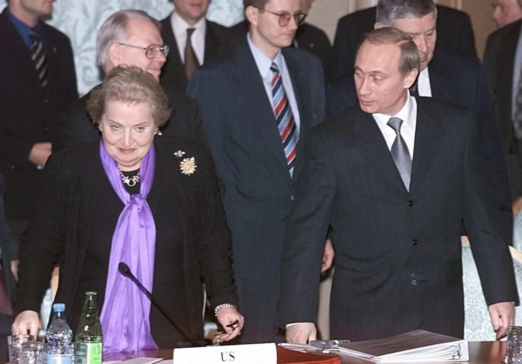 US Secretary of State Madeleine Albright (L) and Russian Acting President Vladimir Putin (R) take a sit during the multilateral peace talks on the Middle East in Moscow, 01 February 2000.