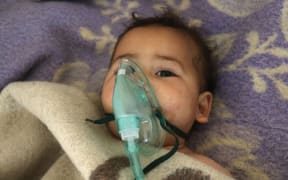 A Syrian child receives treatment at a small hospital in the town of Maaret al-Noman following a suspected toxic gas attack in Khan Sheikhun, a nearby rebel-held town in Syria’s northwestern Idlib province, on April 4, 2017.