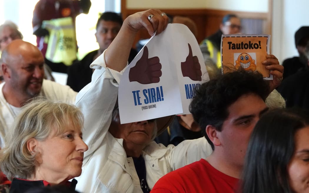 Audience members were encouraged to hold up signs rather than heckling.