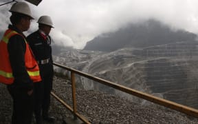 Freeport security personnel looking on at the Freeport McMoRan's Grasberg mining complex, one of the world's biggest gold and copper mines, located in Indonesia's remote eastern Papua province.