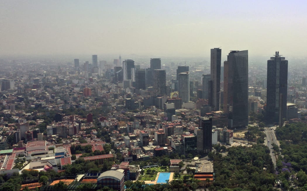 Aerial view showing low visibility due to air pollution in Mexico City, on April 1, 2020, during the coronavirus pandemic.