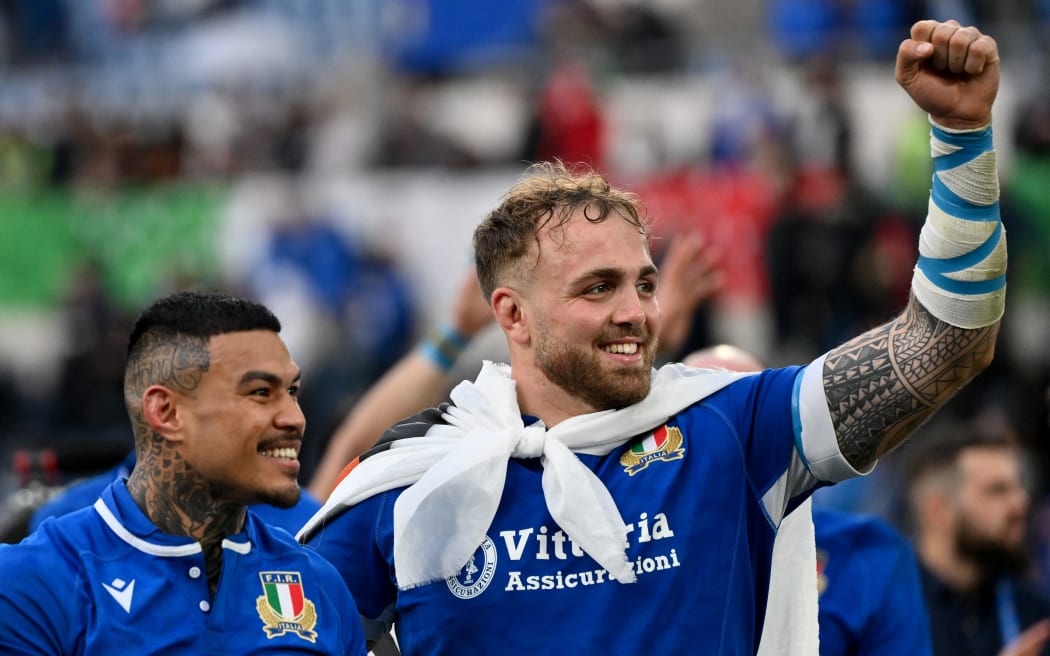 Italy's wing Monty Ioane (L) and Italy's lock Niccolo Cannone celebrate after winning the Six Nations rugby union international match between Italy and Scotland at the Olympic Stadium in Rome, on March 9, 2024. (Photo by Alberto PIZZOLI / AFP)