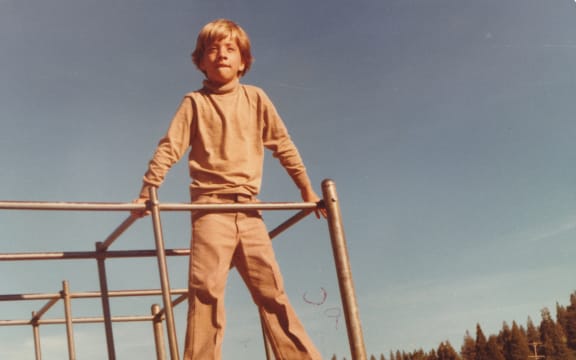Nik Dirga, aged seven, at home in Nevada County in a monochrome camel ensemble.