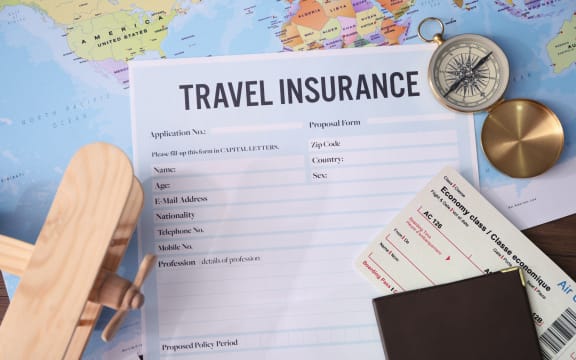 Blank travel insurance form and map on background