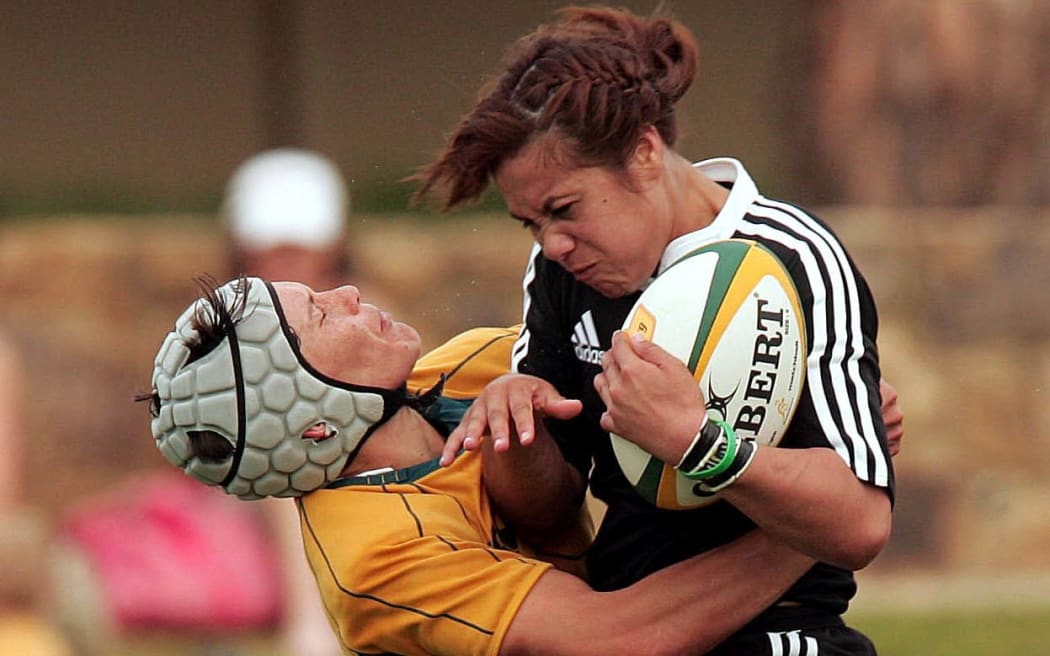Black Fern Huriana Manuel is tackled by Wallaroo Tui Ormsby, 2008.