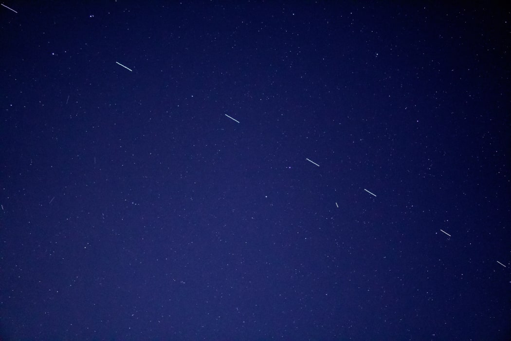 The Starlink 3 train rides across the early morning sky, accompanied by a handful of other satellites.