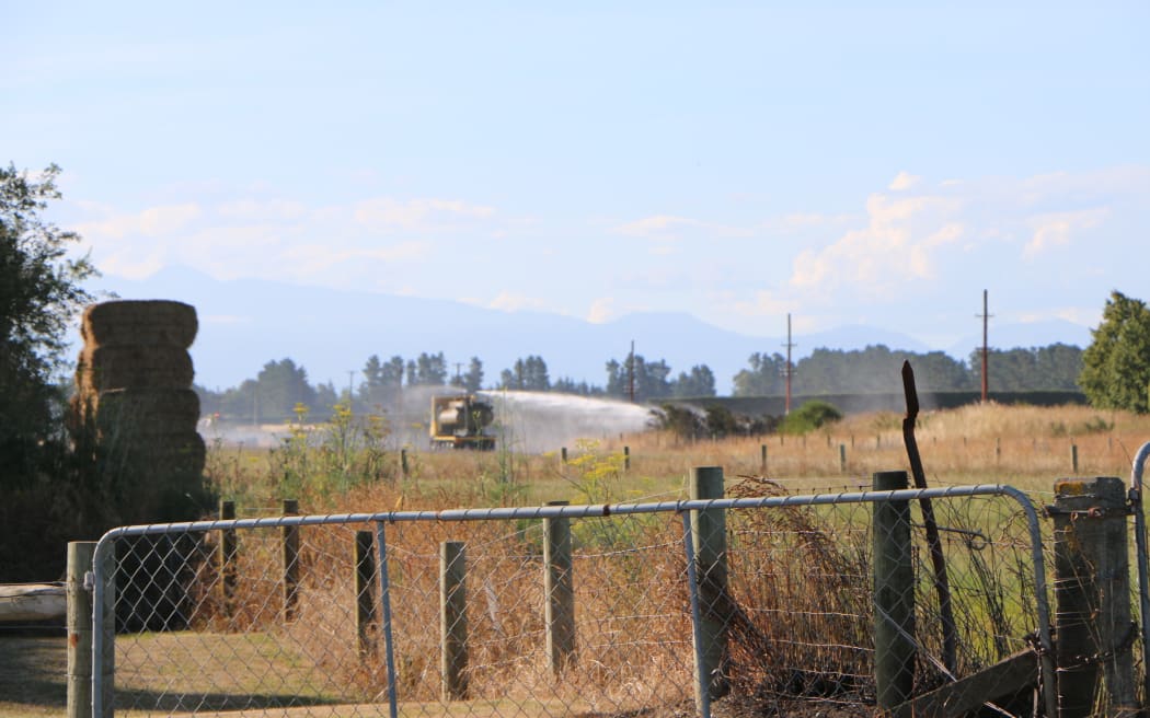 Firefighters fighting a series of fires along the railway line near Kirwee, west of Christchurch.