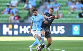 Arion Sulemani of Melbourne City (left) and Scott Wootton of the Phoenix in action during the A-League Men Round 12 match.