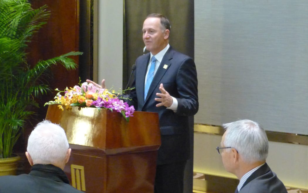 John Key at a breakfast meeting for New Zealand chief executives and youth delegates in Beijing.