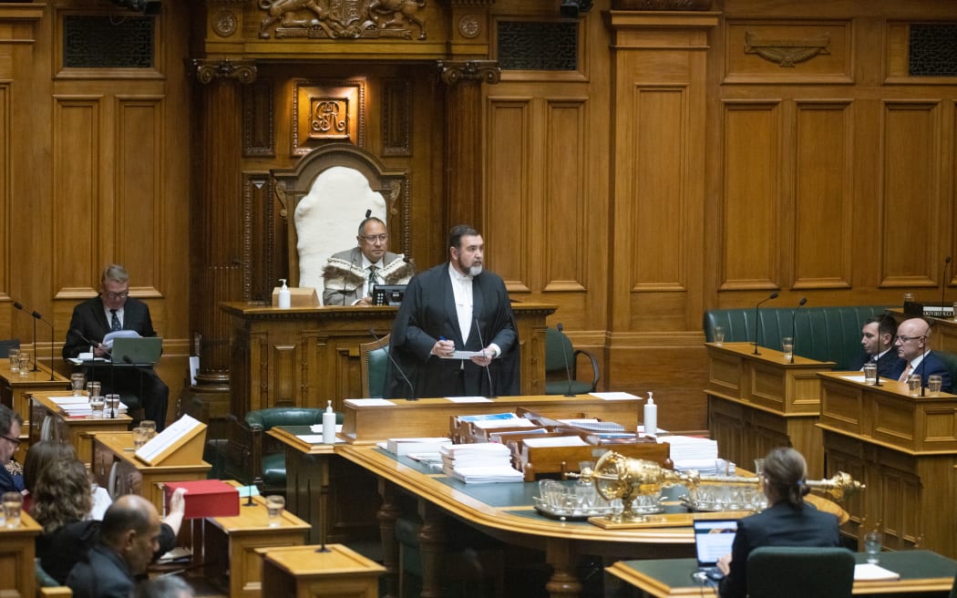 Clerk of New Zealand's House of Representatives, David Wilson tallies party votes from the Table in the Debating Chamber.