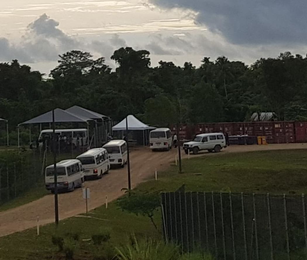 Buses taking people from the Manus detention centre to Lorengau
