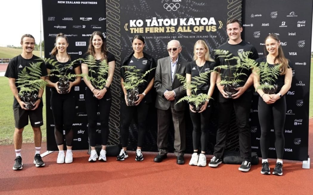 Former Olympic running coach Arch Jelley (centre) announcing the New Zealand track and field team for the 2024 Paris Games.