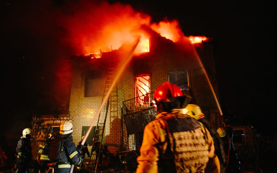 Firefighters extinguish a fire in a private residential building that is damaged by Russian shelling, in Kharkiv, Ukraine, on April 29, 2025 (Photo by Pavlo Pakhomenko/NurPhoto) (Photo by Pavlo Pakhomenko / NurPhoto / NurPhoto via AFP)