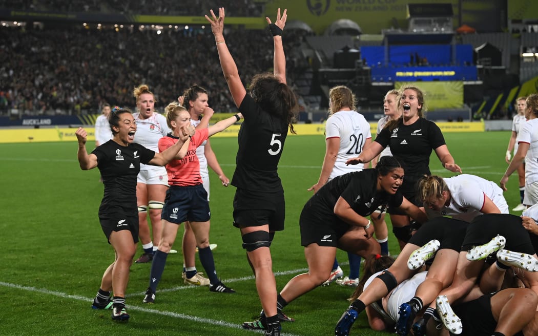 Theresa Fitzpatrick and Chelsea Bremner celebrate New Zealand's win over England in the Women's Rugby World Cup final, 2022.