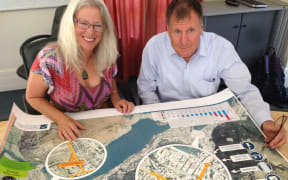 Councillor Alexa Forbes and Queenstown Lakes District Council Infrastructure Manager Dennis Mander study a map showing the new transport strategy proposals.