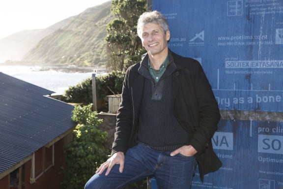 Chris Moller in front of the Wellington "Stilt House"