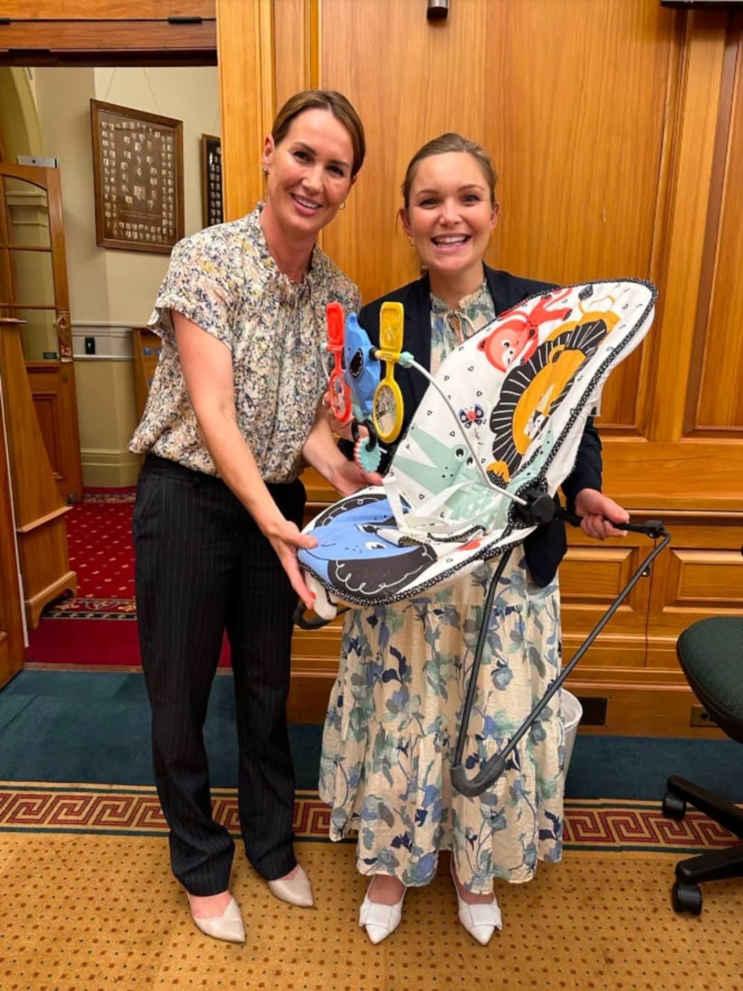 The baby bouncer passed between mothers in Parliament from National MP Nicola Grigg to National MP Katie Nimon.